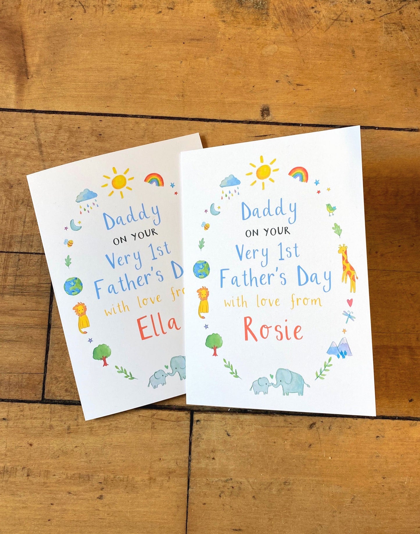Two personalised greetings cards with illustrations, both with a space for a personalised name and the message 'Daddy on your very first Father's Day with love from [name]'.