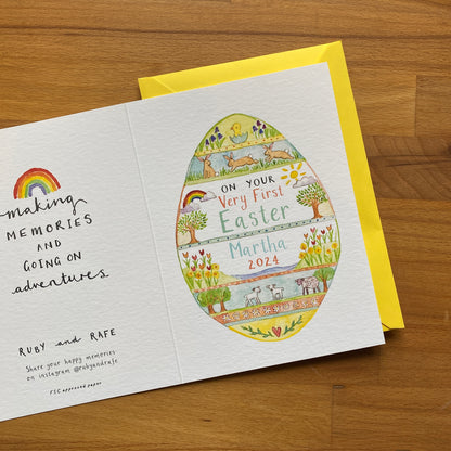 white greetings card with a watercolour easter egg design and 'on your very first easter Martha' custom text